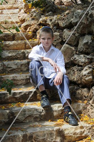  Boy sits on stairs
