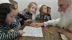 Children learn the letters of the alphabet in teaching cheder