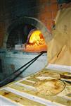 Unleavened bread are baked in a special oven for Kosher for Passover matzos