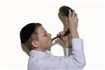 boy blows in the shofar