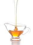    honey pouring into jug
