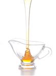    honey pouring into jug
