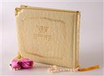  a book of tehillim with pink roses and a string of pearls 