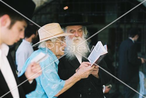 Prayer with tefilin near the kotel