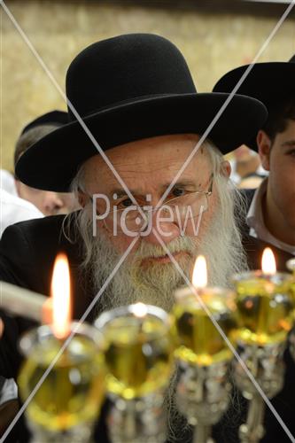 Lighting Hanukkah candles