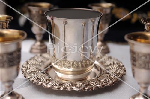 kiddush cup surrounded by little cups