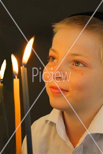 Boy  watches  on menora