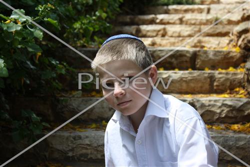  Boy sits on stairs