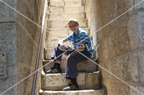  Boy sits on stairs