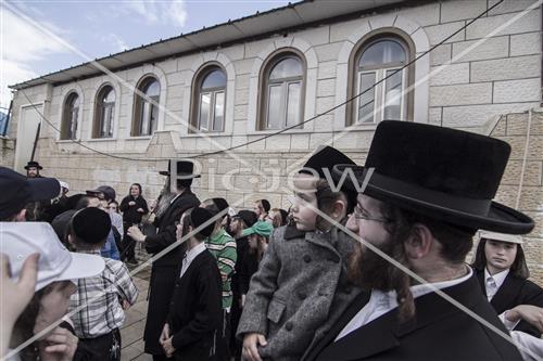 The grave of Rabbi Shimon Bar Yochai in Meron - Jew sings and plays the boy celebrating chalake with his parents.