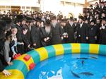 The Rebbe and Chassidim do Tashlich for the Day of Atonement