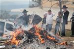 Jews burn leavened bread on Passover eve in the Upper Galilee town of Safed