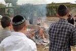 Jews burn leavened bread on Passover eve in the Upper Galilee town of Safed