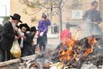 Jews burn leavened bread on Passover eve in the Upper Galilee town of Safed