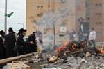 Jews burn leavened bread on Passover eve in the Upper Galilee town of Safed