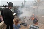 Jews burn leavened bread on Passover eve in the Upper Galilee town of Safed