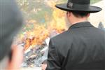 Jews burn leavened bread on Passover eve in the Upper Galilee town of Safed