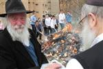 Jews burn leavened bread on Passover eve in the Upper Galilee town of Safed