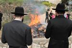 Jews burn leavened bread on Passover eve in the Upper Galilee town of Safed