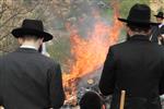 Jews burn leavened bread on Passover eve in the Upper Galilee town of Safed