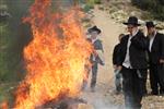 Jews burn leavened bread on Passover eve in the Upper Galilee town of Safed