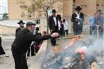 Jews burn leavened bread on Passover eve in the Upper Galilee town of Safed