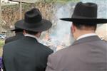 Jews burn leavened bread on Passover eve in the Upper Galilee town of Safed