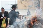 Jews burn leavened bread on Passover eve in the Upper Galilee town of Safed