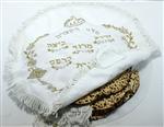 Hand matza in a silk covering