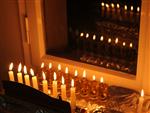 two rows of chanuka lights on a windowsill