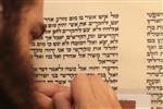 Sofer Stam during the writing of the Torah according to the rules of Halacha