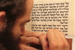 Sofer Stam during the writing of the Torah according to the rules of Halacha