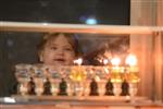 Lighting Hanukkah candles