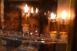 Lighting Hanukkah candles