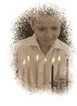 A child lights  Hanukkah candles