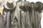 Hats and suits hanging on racks