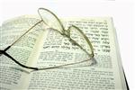 Glasses are placed on the Talmud book