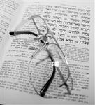 Glasses are placed on the Talmud book