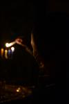 A child lights a menorah at the entrance facing the public domain