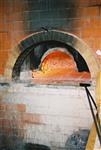 Unleavened bread are baked in a special oven for Kosher for Passover matzos