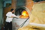 Unleavened bread are baked in a special oven for Kosher for Passover matzos