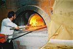 Unleavened bread are baked in a special oven for Kosher for Passover matzos