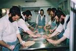 Unleavened bread are baked in a special oven for Kosher for Passover matzos