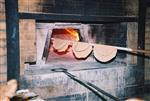 Unleavened bread are baked in a special oven for Kosher for Passover matzos