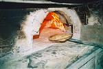 Unleavened bread are baked in a special oven for Kosher for Passover matzos