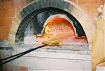 Unleavened bread are baked in a special oven for Kosher for Passover matzos