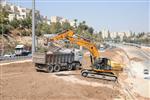 People and machines build and renovate the paths the capital city - Jerusalem