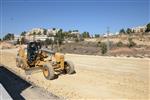 People and machines build and renovate the paths the capital city - Jerusalem