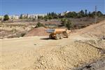 People and machines build and renovate the paths the capital city - Jerusalem