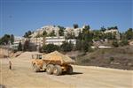 People and machines build and renovate the paths the capital city - Jerusalem